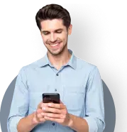 Man in collared shirt holding a phone